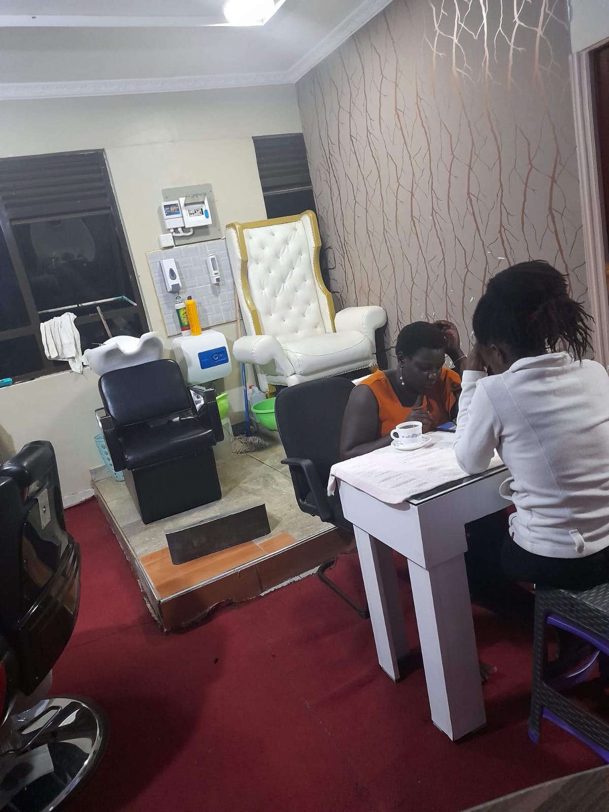 Nail service in progress at Sarma — pedicure throne in the background