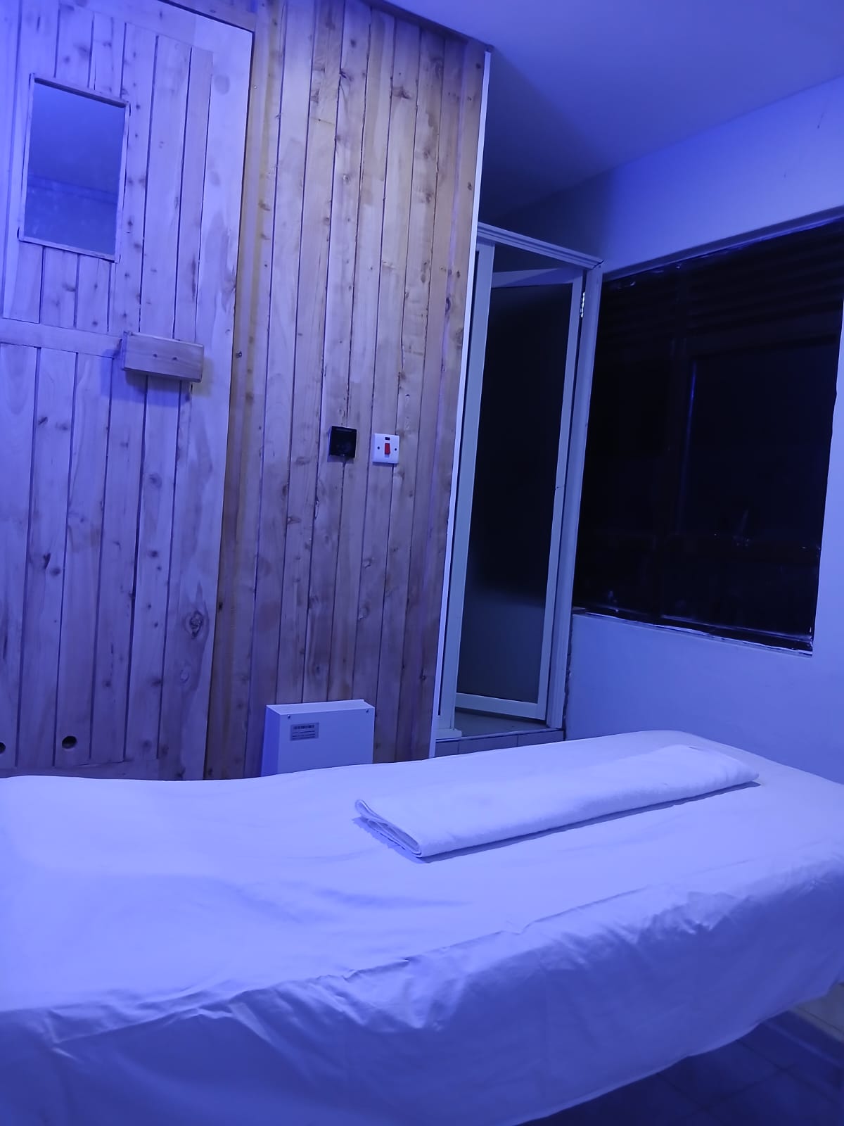 Sauna treatment room with massage bed